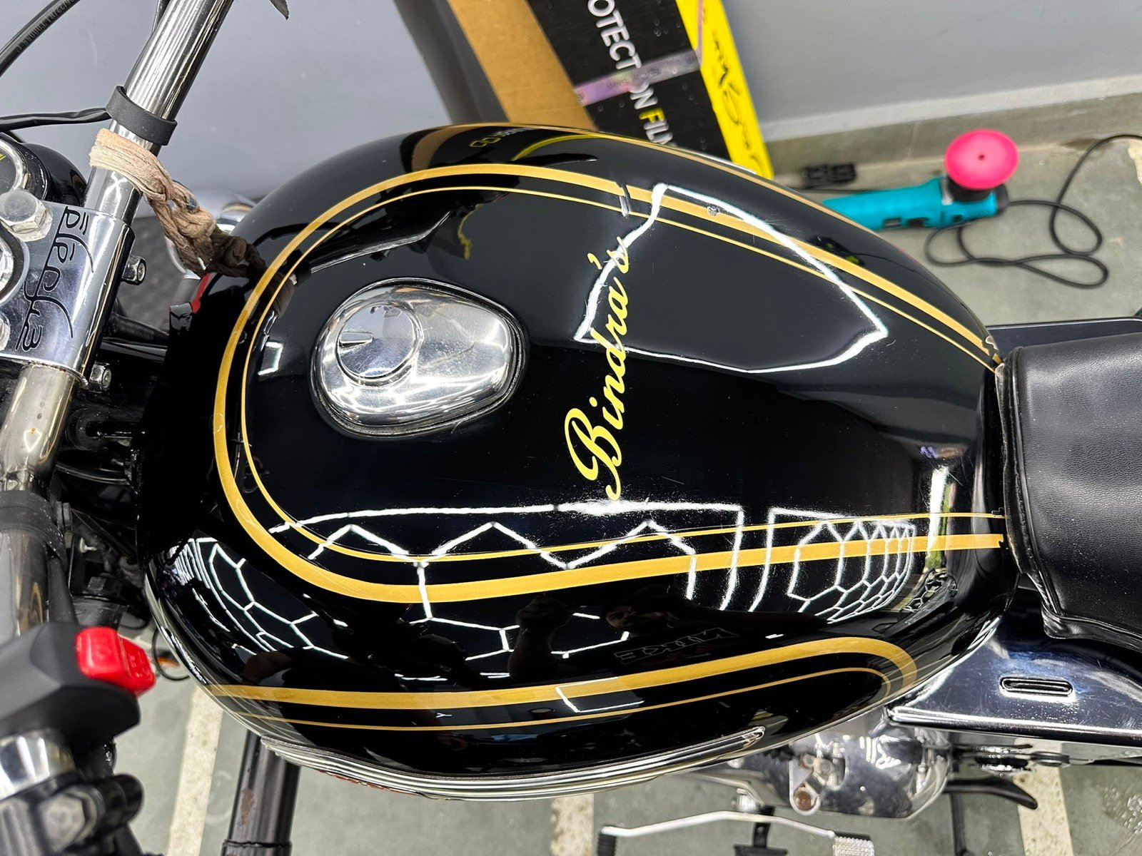 Glossy motorcycle tank after Broverse detailing