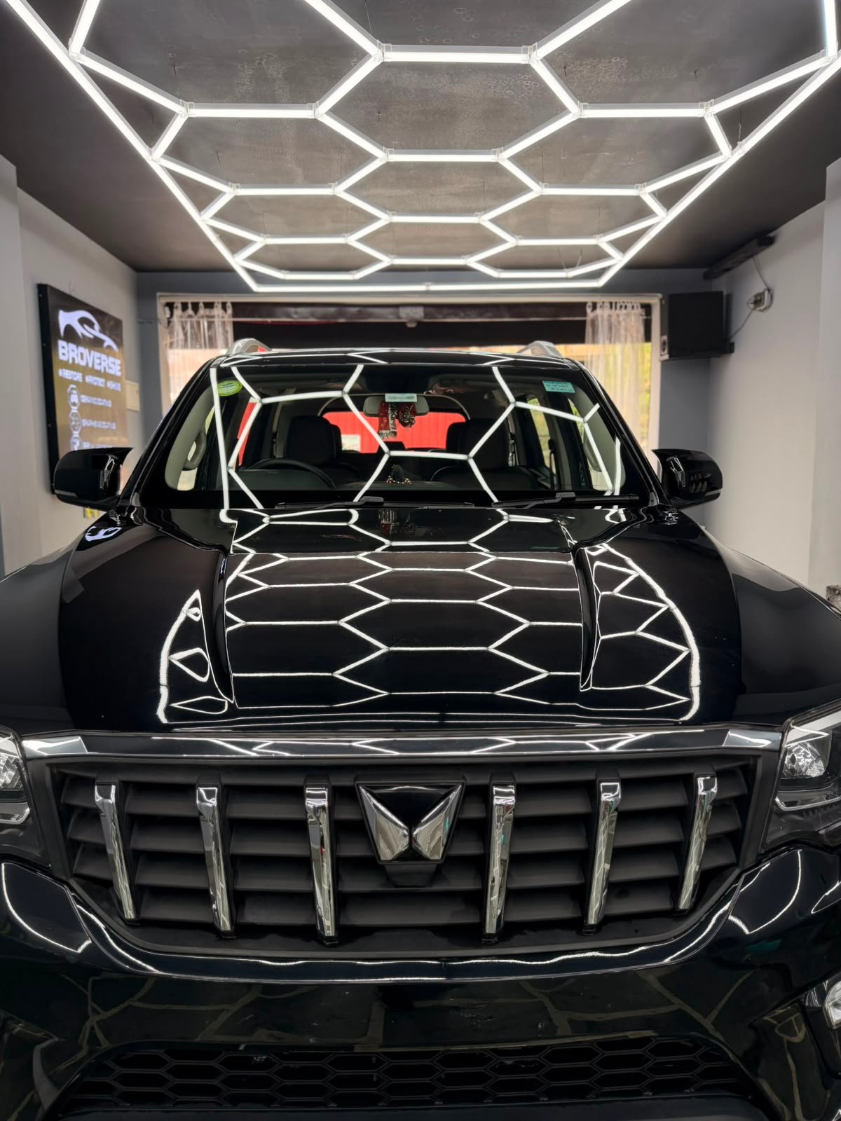 Black Mahindra detailed under Broverse studio lights — Car Detailing Services in Laxmi Nagar