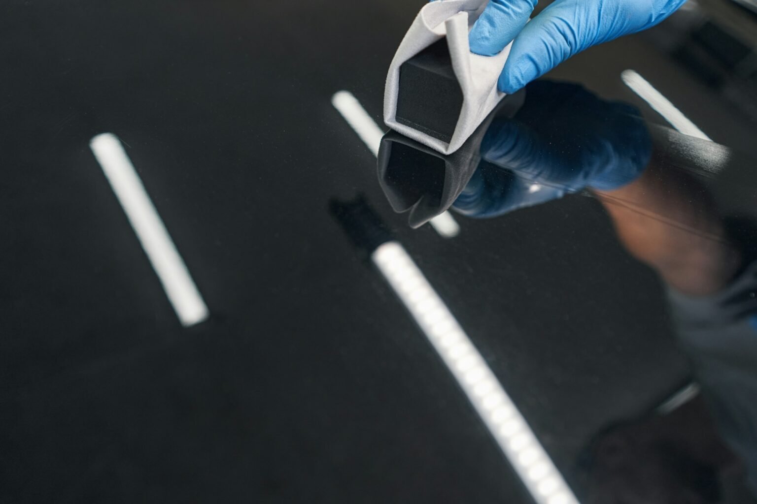 Ceramic coating being applied to a vehicle